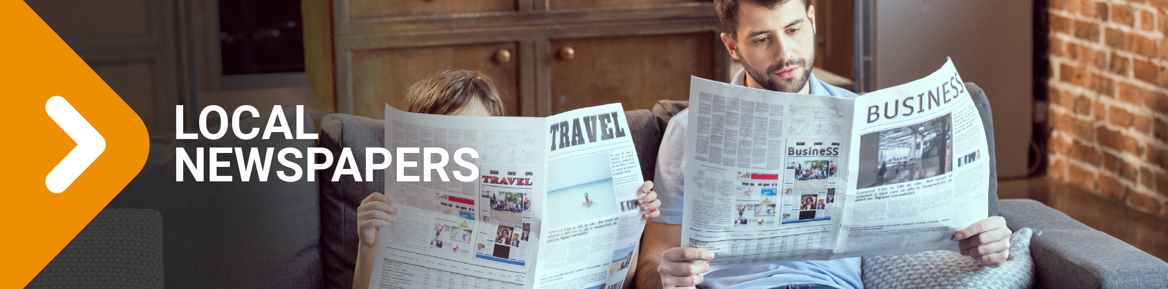 "Local Newspapers" arrow graphic over photo of man and child reading newspapers together